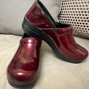 Gently used Dansko clogs size 10 (40) in red marble glossy patent